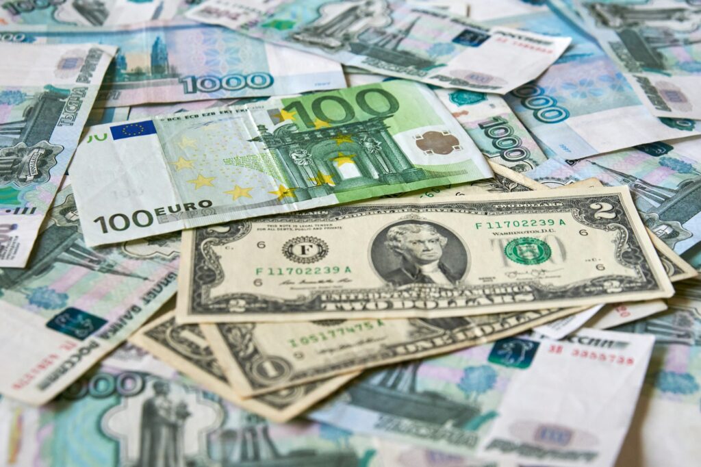 background of paper bills dollars, euros and rubles. Currency exchange rate